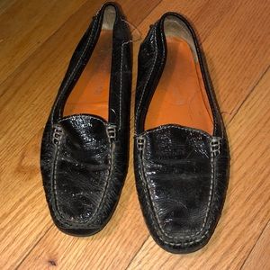 Black patent leather slip on shoes